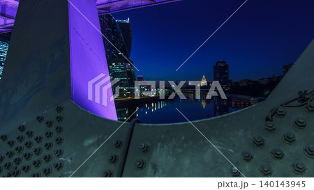 Moscow river near the skyscrapers of Moskva City district in the night timelapse view under the bridge. Moscow river near the skyscrapers of Moskva City district in the night timelapse view under the bridge. 140143945
