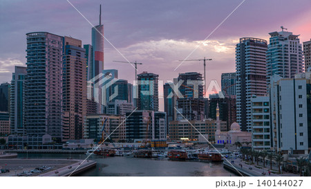 Dubai Marina towers and canal in Dubai night to day timelapse 140144027