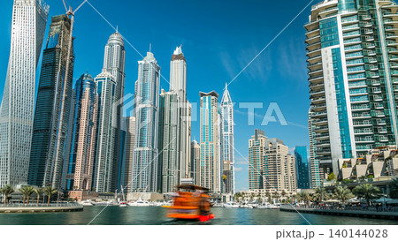 Dubai Marina towers in Dubai at day time timelapse 140144028