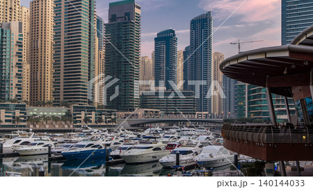 Dubai Marina at Blue hour night to day timelapse with yachts Dubai Marina at Blue hour night to day timelapse with yachts 140144033