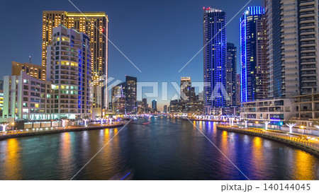 Dubai Marina towers and canal in Dubai day to night timelapse Dubai Marina towers and canal in Dubai day to night timelapse 140144045