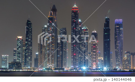 Dubai Marina skyline day to night timelapse as seen from Palm Jumeirah in Dubai, UAE. Dubai Marina skyline day to night timelapse as seen from Palm Jumeirah in Dubai, UAE. 140144046