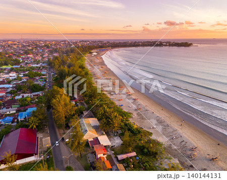 The natural beauty of Indonesia's long beaches with beautiful forests and seas at sunrise The natural beauty of Indonesia's long beaches with beautiful forests and seas at sunrise 140144131