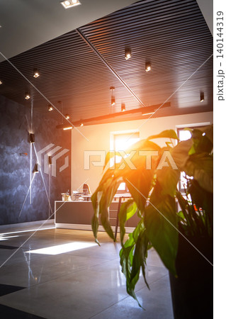 Office room with blank computer display,table,chair,cement floor,glass walls with night city view. Mixed media . 140144319