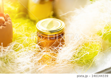 Selective focus. Linden honey in a jar. Leaves and flowers of linden. Freshly linden honey. Selective focus. Linden honey in a jar. Leaves and flowers of linden. Freshly linden honey. 140144339