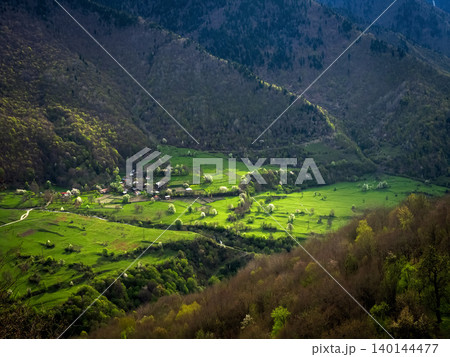 Sunlit valley nestled between rugged hills. Georgia. Sunlit valley nestled between rugged hills. Georgia. 140144477