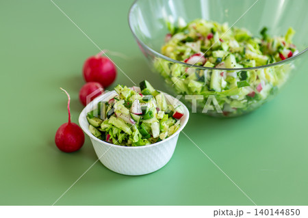 fresh vegetable salad with cucumber and radish in bowl fresh vegetable salad with cucumber and radish in bowl 140144850