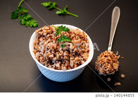 Homemade buckwheat porridge with fresh parsley garnish Homemade buckwheat porridge with fresh parsley garnish 140144855