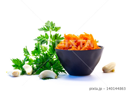 Fresh carrot appetizer with garlic and green parsley Fresh carrot appetizer with garlic and green parsley 140144863