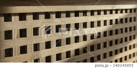 Wooden lattice panel close up. Acacia wood storage furniture with decorative grid pattern. Interior design texture for rustic decor and background.. Wooden lattice panel close up. Acacia wood storage furniture with decorative grid pattern. Interior design texture for rustic decor and background.. 140145055
