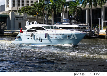 Luxury boat motor yacht in marina. Luxury yacht at Biscayne bay. Boating and yachting charter. Luxury lifestyle. Vacation on summer. Yacht at sea. Sea vacation on summer 140145402
