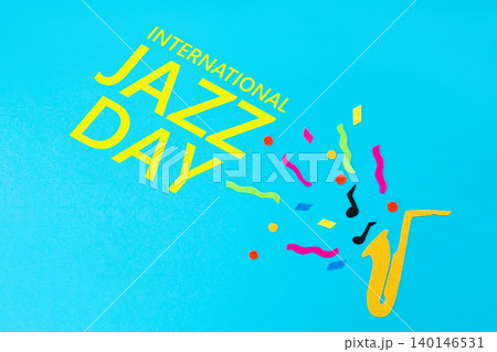Festival and holiday. A cutted out of felt saxophone on a blue background. Flat lay. International Jazz Day 140146531