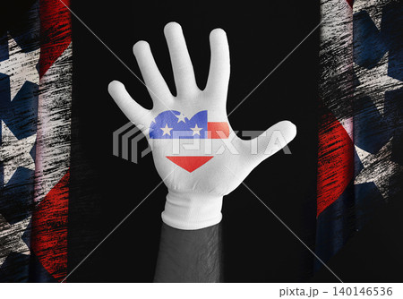 Hand of afro-american person in white glove with American Flag heart. Happy Martin Luther King Day concept 140146536