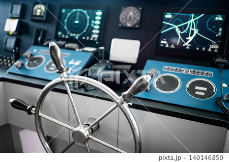 Wheelhouse steering console with digital dashboard of GPS navigation, marine radar and VHF Radio Wheelhouse steering console with digital dashboard of GPS navigation, marine radar and VHF Radio 140146850