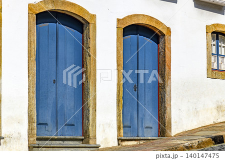 Old doors with arches and stone frames Old doors with arches and stone frames 140147475