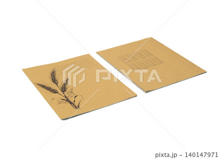 two closed school notebooks made of recycled craft paper on an isolated white background two closed school notebooks made of recycled craft paper on an isolated white background 140147971