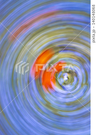 Abstract Orange Flowers in Blue Swirling Motion Abstract Orange Flowers in Blue Swirling Motion 140148068