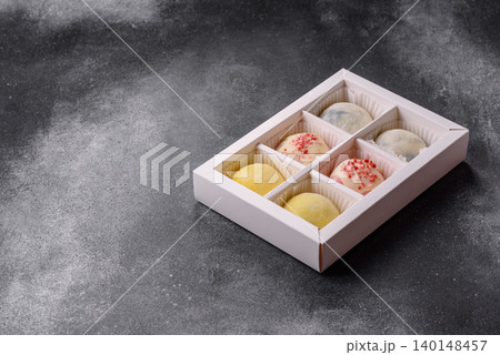 Japanese sweet frozen mochi with rice dough, fruit, and chocolate filling. Japanese mochi Japanese sweet frozen mochi with rice dough, fruit, and chocolate filling. Japanese mochi 140148457
