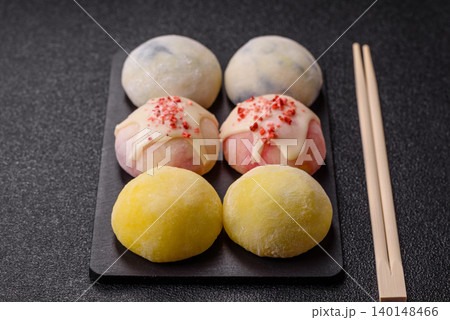 Japanese sweet frozen mochi with rice dough, fruit, and chocolate filling. Japanese mochi Japanese sweet frozen mochi with rice dough, fruit, and chocolate filling. Japanese mochi 140148466