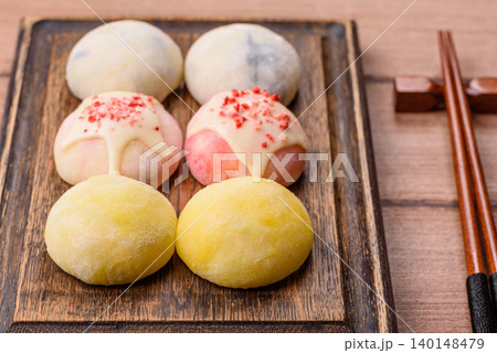 Japanese sweet frozen mochi with rice dough, fruit, and chocolate filling. Japanese mochi Japanese sweet frozen mochi with rice dough, fruit, and chocolate filling. Japanese mochi 140148479
