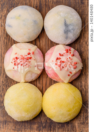 Japanese sweet frozen mochi with rice dough, fruit, and chocolate filling. Japanese mochi Japanese sweet frozen mochi with rice dough, fruit, and chocolate filling. Japanese mochi 140148480