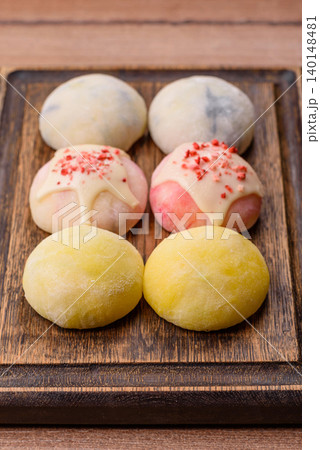 Japanese sweet frozen mochi with rice dough, fruit, and chocolate filling. Japanese mochi Japanese sweet frozen mochi with rice dough, fruit, and chocolate filling. Japanese mochi 140148481