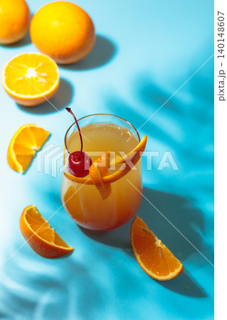 Cocktail Tequila sunrise with orange juice, silver tequila, grenadine, and ice. Cocktail Tequila sunrise with orange juice, silver tequila, grenadine, and ice. 140148607