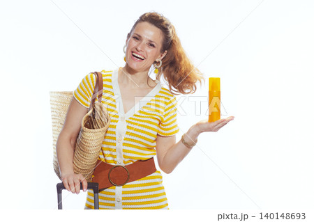 Woman Presenting Sunscreen Bottle for Summer Travel Woman Presenting Sunscreen Bottle for Summer Travel 140148693