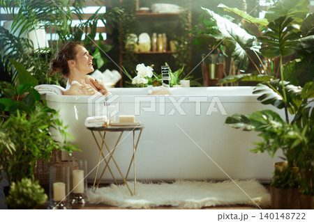 Joyful Retreat: Woman Enjoying a Luxurious Spa Bath 140148722