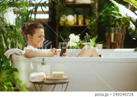 Serene Bathtub Relaxation with Smartphone 140148726