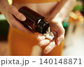 Handful of Daily Vitamins and Nutritional Supplements 140148871