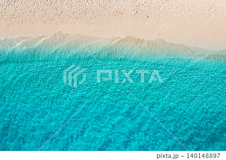 Relaxing aerial beach scene, summer vacation holiday template banner. Waves surf with amazing blue ocean lagoon, sea shore, coastline. Perfect aerial drone top view. Peaceful bright beach, seaside Relaxing aerial beach scene, summer vacation holiday template banner. Waves surf with amazing blue ocean lagoon, sea shore, coastline. Perfect aerial drone top view. Peaceful bright beach, seaside 140148897