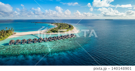 Gorgeous aerial Maldives island overwater villas turquoise panoramic breathtaking luxury resort tropical paradise serene idyllic coastal escape drone dreamy vibrant exotic wide banner wanderlust Gorgeous aerial Maldives island overwater villas turquoise panoramic breathtaking luxury resort tropical paradise serene idyllic coastal escape drone dreamy vibrant exotic wide banner wanderlust 140148901