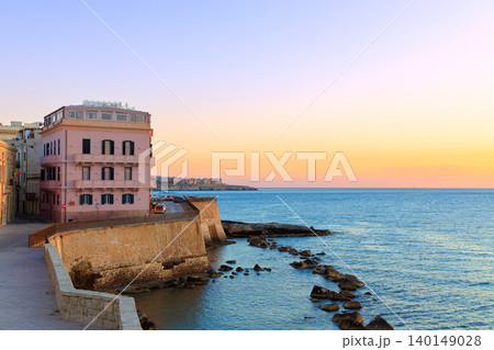 waterfront resort town coast line urban scene summer vacation destination peaceful sun rise time 140149028
