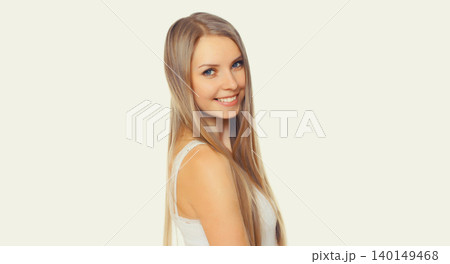 Portrait of beautiful blonde smiling young woman with long hair on white background Portrait of beautiful blonde smiling young woman with long hair on white background 140149468