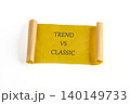 A vibrant scroll rests on a clean surface, featuring the words Trend vs Classic in striking text. This scene captures the essence of style discussions and choices 140149733