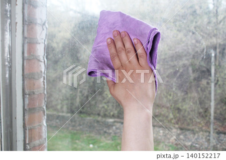 streaks on a dirty window. washing windows by hand 140152217