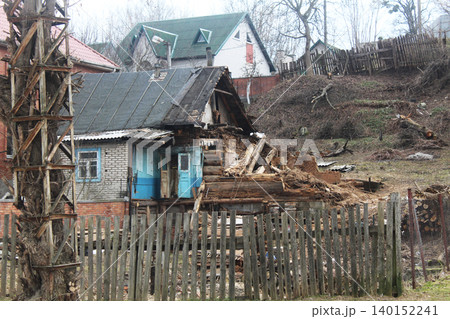 Old wooden dilapidated house. War and Destruction Old wooden dilapidated house. War and Destruction 140152241