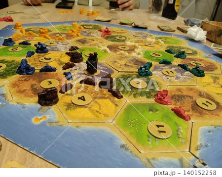 Mozyr, Belarus, April 10 2025: catan board game. Players' chips on the playing field 140152258