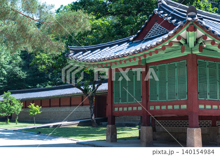 Seoul, South Korea - May. 30, 2026 : Peaceful and scenic view of traditional Korean architecture and lush greenery at Jongmyo Shrine, Seoul, on a clear early summer afternoon 140154984