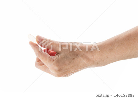 Mid aged female hold transparent pill isolated on white 140158888