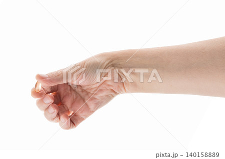 Mid aged female hold transparent pill isolated on white 140158889