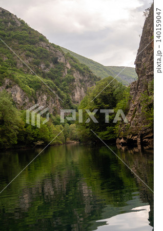 Visitors enjoy the beauty of Matka Canyon in Skopje, North Macedonia by the water. Visitors enjoy the beauty of Matka Canyon in Skopje, North Macedonia by the water. 140159047