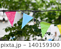 Colorful outdoor party bunting and string lights 140159300