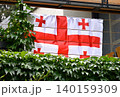 Georgian flag on balcony with green ivy 140159309