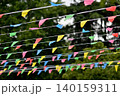 Colorful bunting flags hanging outdoors 140159311