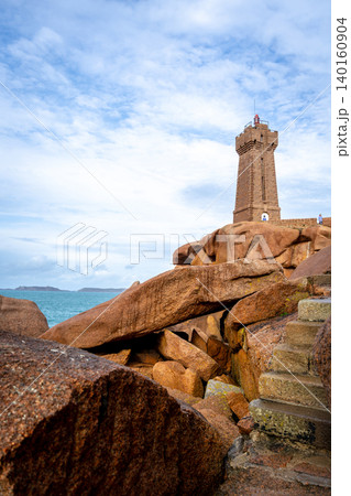 Mean Ruz lighthouse standing on granite bridge in Tregastel, Brittany, France 140160904