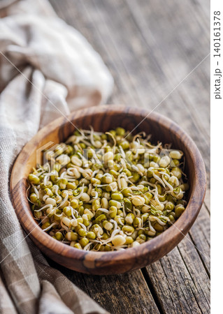 Mung Bean Sprouts in Wooden Bowl on Rustic Tablecloth for Healthy Eating and Vegetarian Cooking 140161378