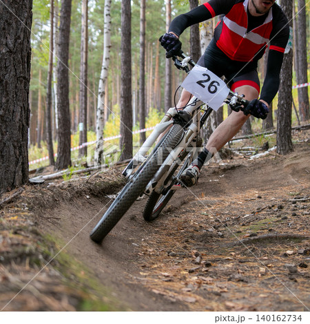 Close-up mountain bike racer ride turn 140162734