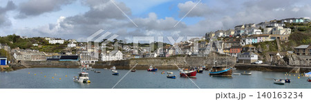 Panoramic view of the harbor at Mevagissey on the south coast of Cornwall, England. Panoramic view of the harbor at Mevagissey on the south coast of Cornwall, England. 140163234